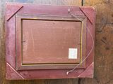 a picture of a picture hanging on a wooden wall