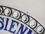 a close up of a plate with a name on it