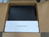 a box with a laptop inside of it on the floor