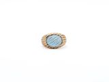 a close up of a ring on a white surface