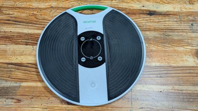 a remote control sitting on top of a record on a table