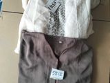 a box of clothing that is sitting on top of a cardboard box