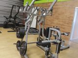 an image of a gym room with equipment on the floor