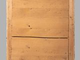 an old wooden box with a handle on a gray background