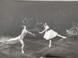 black and white photograph of two ballerinas performing in a dance studio