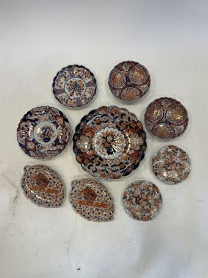 many different types of shells on a white surface