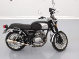 a black and white motorcycle parked in a room