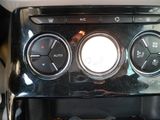 a close up of a car radio with buttons and controls