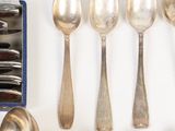 a lot of spoons that are sitting on a table