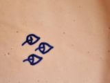 someone is holding a plate with a blue fish design on it