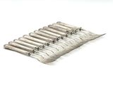 six forks that are sitting on top of each other