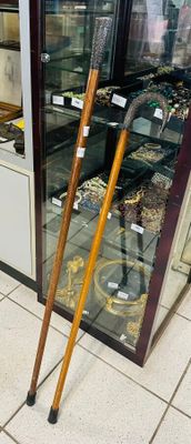a display case with a pair of walking canes in front of it