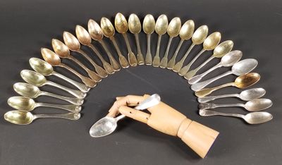 a lot of spoons arranged in a circle on a table