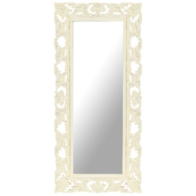 un grand miroir blanc dont le cadre est orné d'un motif floral