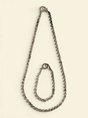 chain with a loop of silver beads on a white background