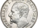 une vieille pièce d'argent sur laquelle figure le portrait d'un homme