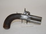 an old gun that is on display on a table