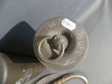a close up of a metal object with a tag on it