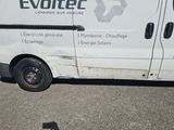 a white van that is parked in the parking lot