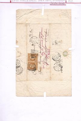 un vieux bout de papier sur lequel figurent des inscriptions et un cachet
