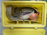 a yellow box with a hose and a hose in it