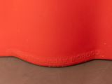 an image of a close up of a red plastic container
