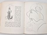a book with a drawing of a woman and a cat