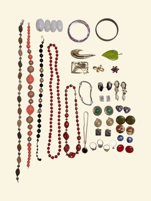 a picture of a collection of jewelry on a white background