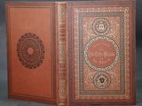 a brown book with an ornate design on the cover