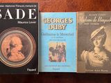 three books that are sitting on a table