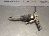an image of a drill on the floor in front of a wall