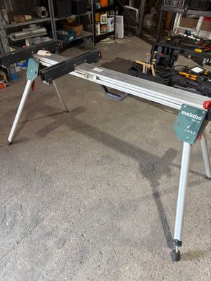 a picture of a workbench in a garage with tools on it