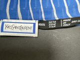 a close up of a blue and white tie with a tag on it