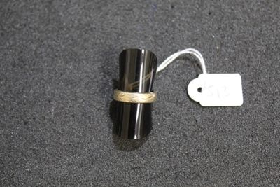 a small black object with a tag on it
