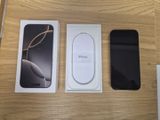 two iphones sitting on a table next to each other