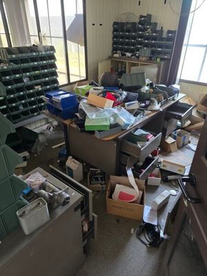 a cluttered room with a lot of clutter and boxes
