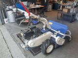 a small machine that is parked in a garage
