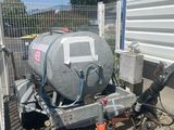 an image of a trailer with a tank attached to the back of it