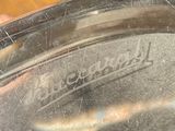 a close up of a silver plate with a logo on it