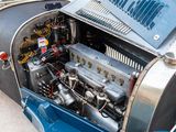 a very old car with a very nice engine in it