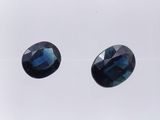 a pair of blue sapphires on a white background
