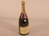 a bottle of wine that is sitting on a table