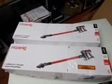 two boxes of vacuum cleaners sitting on top of each other on a table