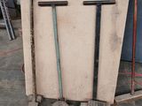 a pile of tools sitting on a pallet in a garage
