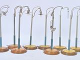 seven pairs of surgical instruments on display on a white surface