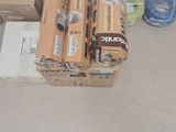 many boxes of different types of electrical equipment on the floor
