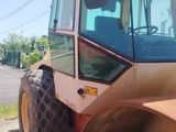 a picture of a construction vehicle parked on the side of the road