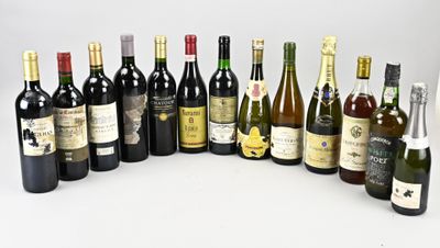 many bottles of wine that are lined up on the table