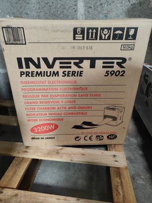 a box of inverter batteries sitting on top of a wooden pallet