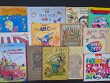 a lot of children ' s books that are on the table